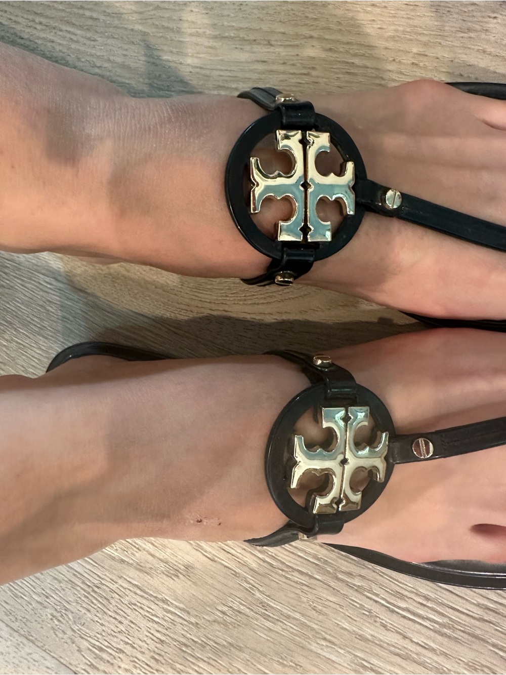 Tory Burch Black plastic Logo T-Strap Sandals with Gold Medallions
